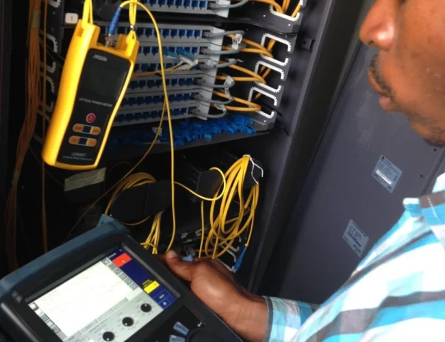 Telecom rack with terminated fiber optic cables and enterprise servers